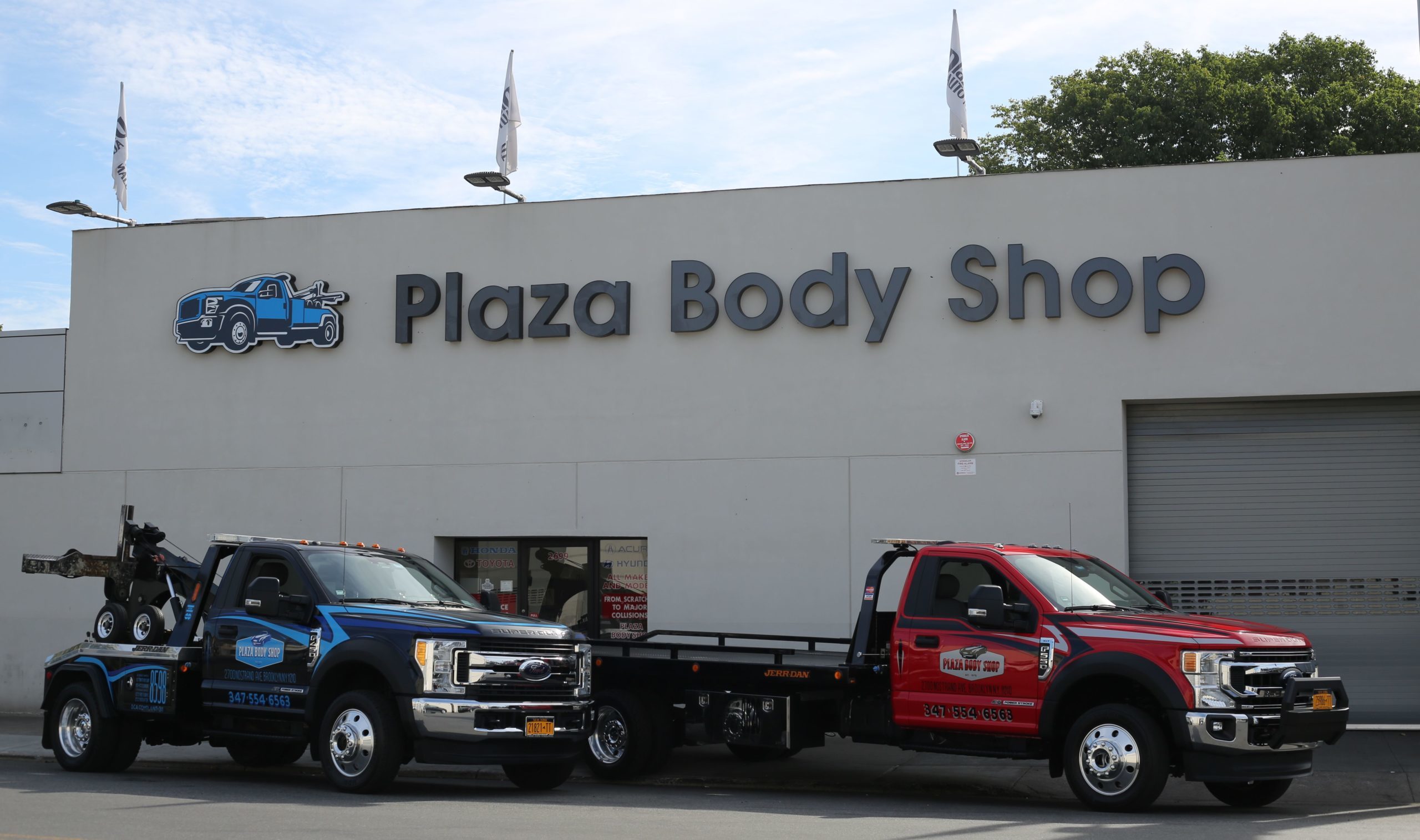 Plaza Body Shop facility and tow trucks on Nostrand Avenue