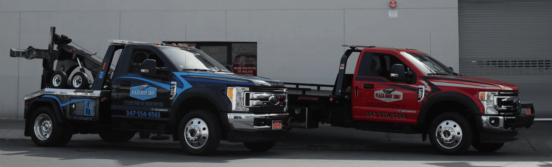 Two Plaza Body Shop tow trucks ready for service