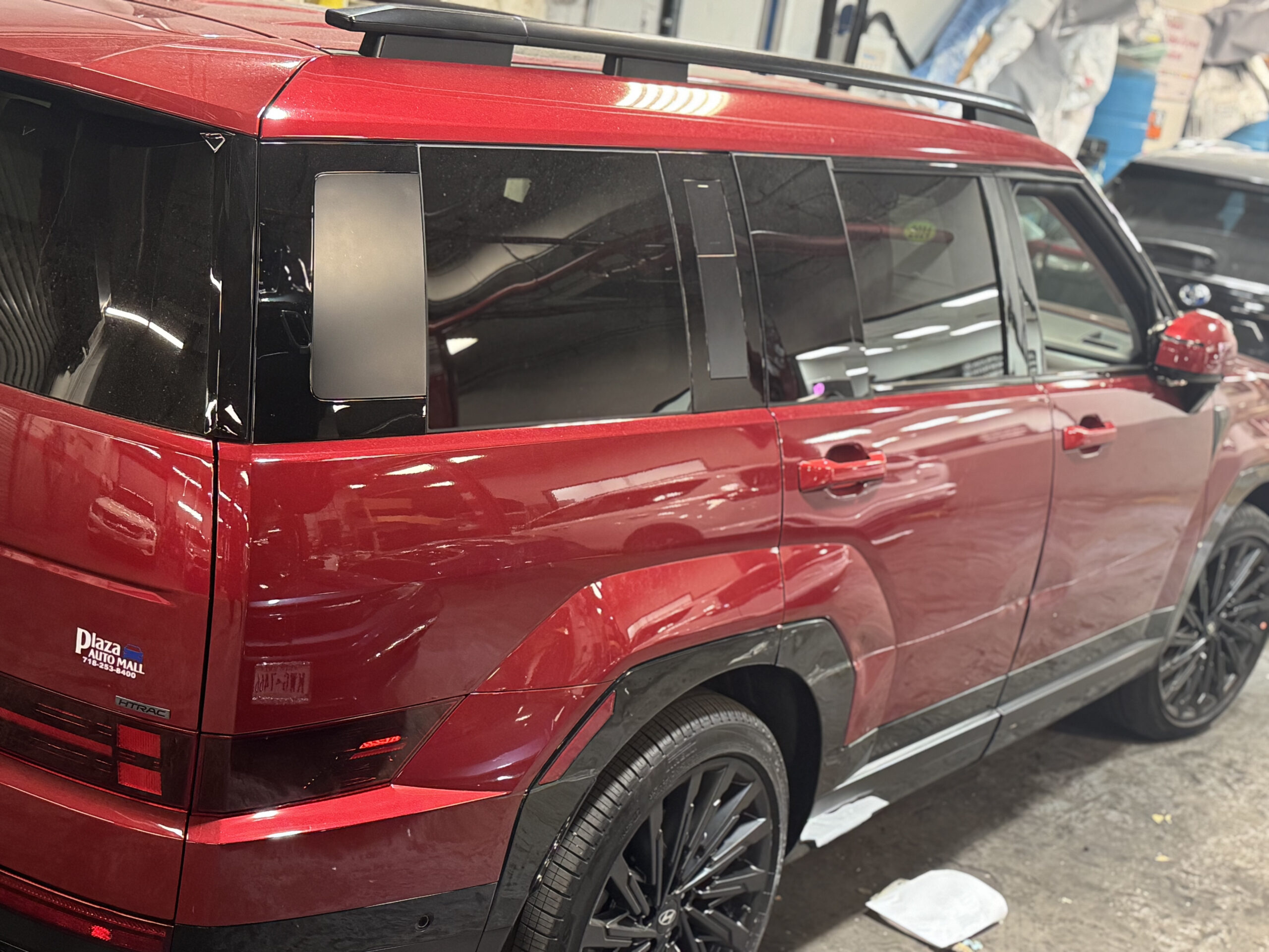 Red SUV after Plaza Body Shop repaired and refinished the damaged side